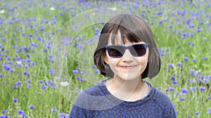 Portrait of cheeky kid with sunglasses for joy and childhood