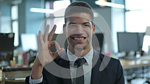 Portrait of Cheerful African Businessman showing Ok Sign