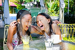 Portrait of Cheerful Asian Little Girls in Swimsuit Smiling, Laughing and Embracing Each Other Spending Time Together Outdoor