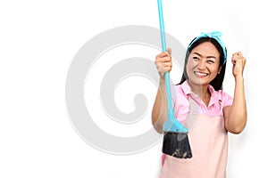 Portrait of Cheerful Asian Woman Having Fun While Cleaning Isolated On White. Happy housewife holding broom,