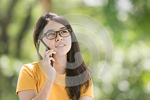 Portrait of a cheerful asian young woman
