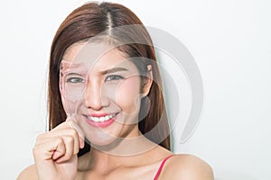 Portrait of cheerful beautiful woman making curl eyelashes using