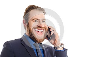Portrait of a cheerful businessman talking on the phone isolated on a white background