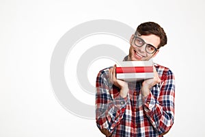 Portrait of a cheerful casual male student in eyeglasses