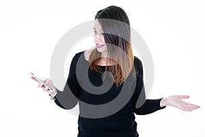 Portrait of a cheerful casual  young woman holding mobile phone