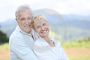 Portrait of cheerful couple on countryside