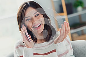 Portrait of cheerful cute girl toothy smile have good mood chatting telephone weekend apartment inside