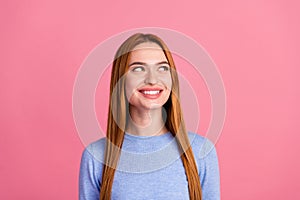 Portrait of cheerful dreamy girl with red foxy hairdo wear blue pullover look at sale empty space isolated on pink color