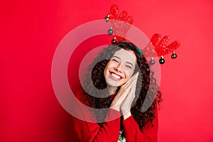 Portrait of cheerful funny funky brunette curly hair girl ready for christmas newyear party wait expect x-mas tradtion