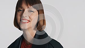 Portrait of cheerful girl with bob hair looking smiling on camera isolated over white background. Positive girl