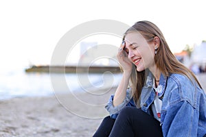 Portrait of cheerful girl who poses on camera and cute laughs si