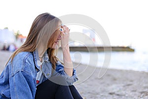 Portrait of cheerful girl who poses on camera and cute laughs si