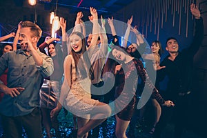 Portrait of cheerful group of people mates dancing in nightclub have fun on noel discotheque wear formalwear dress skirt