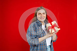 Portrait of cheerful, happy woman receive gift, smiling excited. Girl holding wrapped present, celebrating