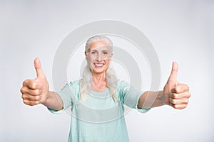 Portrait of cheerful lady showing thumb-up smiling advertising wearing teal pullover isolated over white background