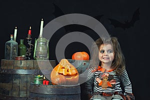Portrait of a cheerful little girl in the Studio on Halloween day