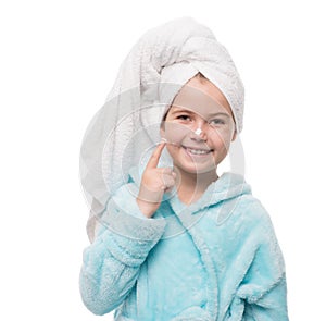 portrait of cheerful little girl after taking a shower with crea