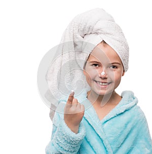 portrait of cheerful little girl after taking a shower with crea