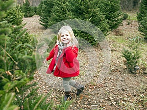 Portrait of cheerful little girl walking outside