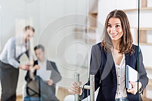Portrait of cheerful modern female professional in modern office
