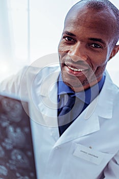 Portrait of a cheerful professional male doctor