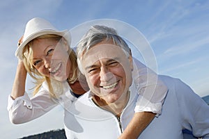 Portrait of cheerful senior couple having fun on a beautiful sunny day