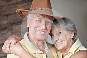 Portrait of cheerful senior couple at home