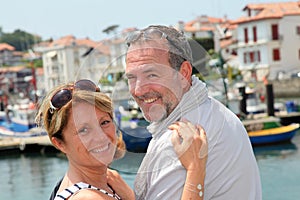 Portrait of cheerful senior couple travelling