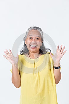 Portrait of a cheerful senior woman white background