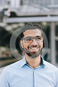 Portrait of cheerful Syrian man at the train station