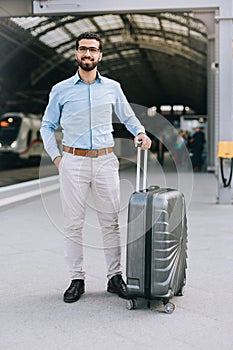 Portrait of cheerful Syrian man at the train station