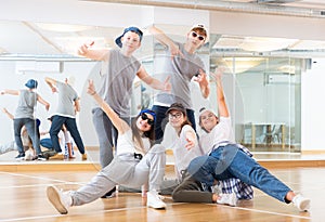 Teens hip hop dancers posing in studio