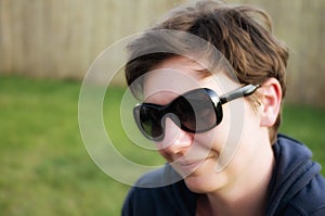 Portrait of cheerful woman with stylish sunglasses.