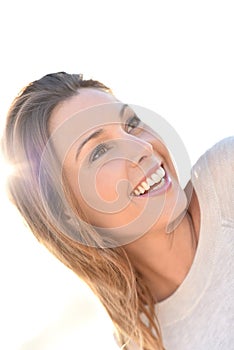 Portrait of cheerful woman on white background