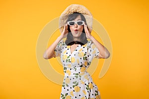 Portrait cheerful young asian woman happy smile dressing springtime female style fashion and sunglasses isolated on yellow