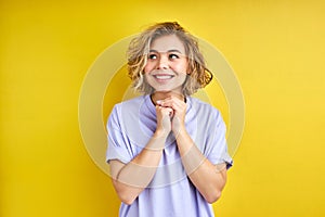 portrait of cheerful young blonde caucasian female looking at side with dreamy face