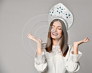 Portrait of a cheerful young girl holding copy space on her palm