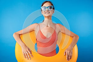 Portrait of a cheerful young girl in swimsuit