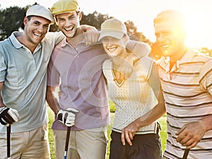 Portrait of cheerful young golfers on golf course