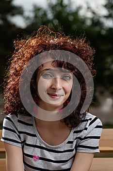 Portrait of a cheerful young latina woman smiling