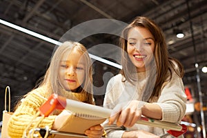 Mother and Daughter Shopping in Supermarket