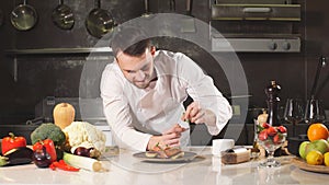 Portrait of chef looking straight to the camera in kitchen he enjoying the time at his workplace