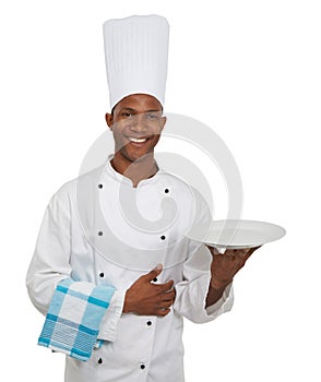 Portrait, chef and plate in studio in hospitality career, happy server, waiter and professional in food industry