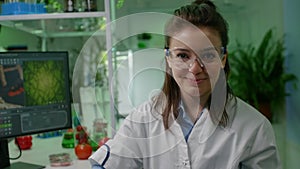 Portrait of chemist researcher in medical equipment looking into camera