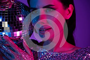 Portrait of chic classy lady dj on discotheque with disco ball christmas event  neon futuristic background