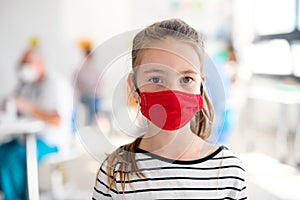 Portrait of child with face mask, coronavirus, covid-19 and vaccination concept.