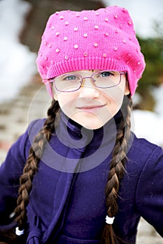 Portrait of child girl with pigtail in pink barret photo