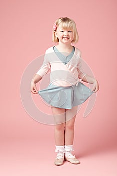 Portrait, child or girl by pink background for ballet, training and practice dance with smile in studio. Mockup space