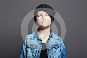 Portrait of child. handsome little boy in jeans and hat