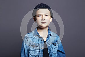 Portrait of child. handsome little boy in jeans and hat